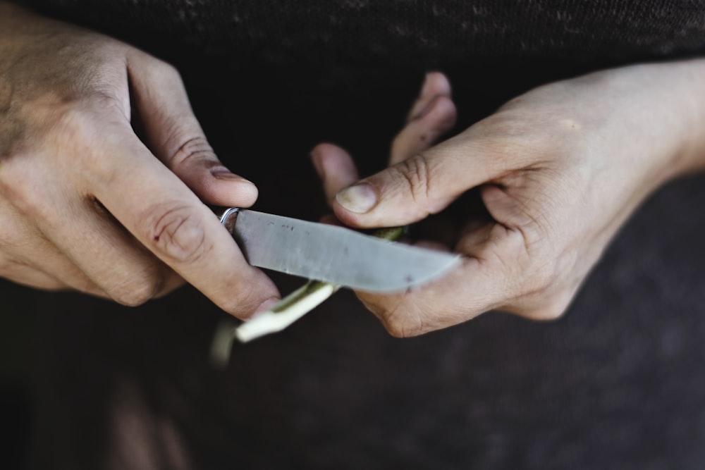 person holding knife