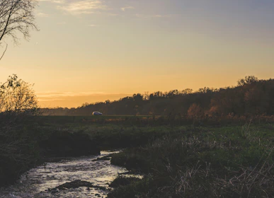 Sunset over the serene Ganges river as seen from a txai service vehicle en route to Rishikesh.