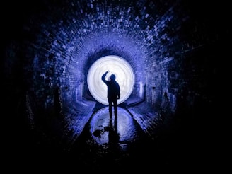person standing on tunnel