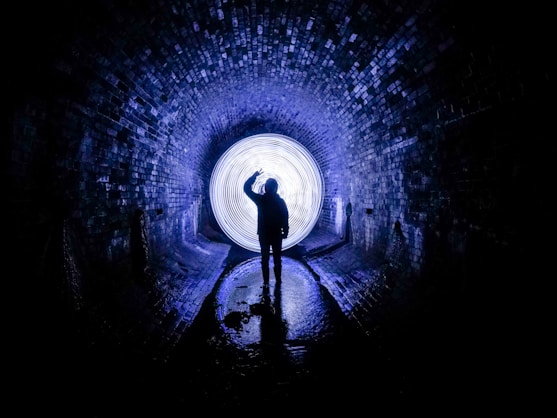 person standing on tunnel