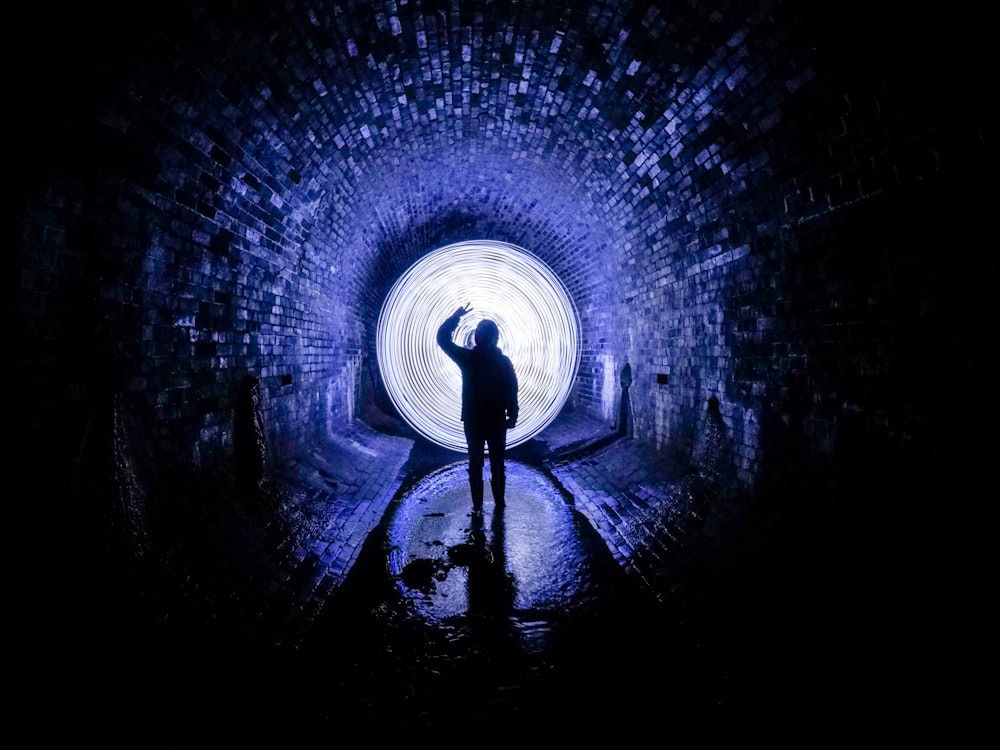 person standing on tunnel