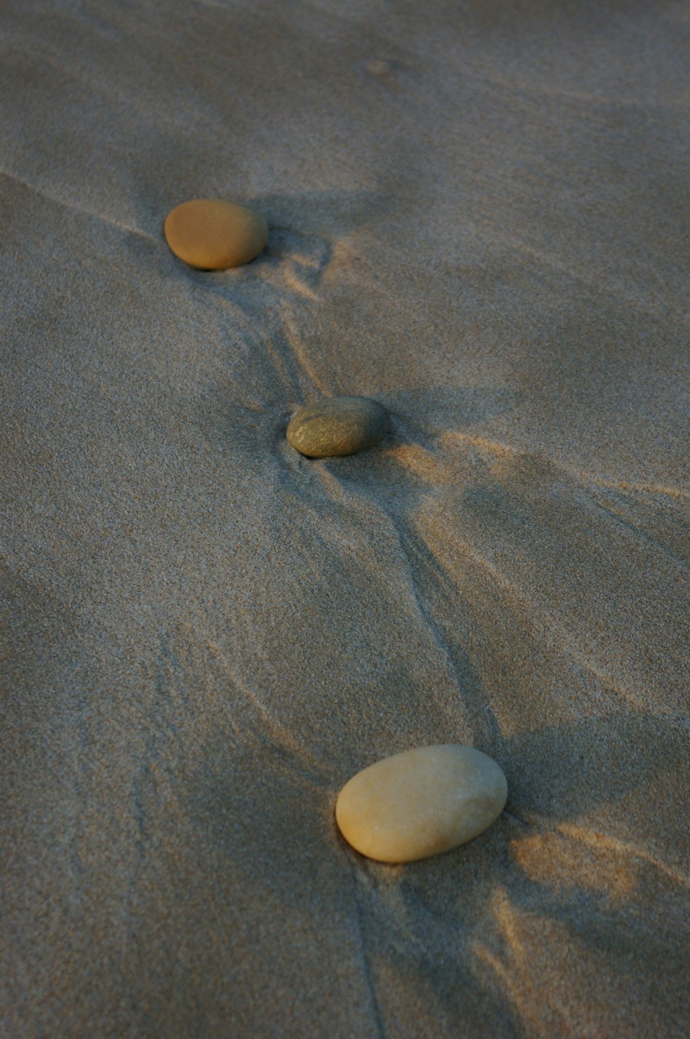grey stones on grey sand