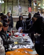 people standing beside table