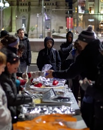 people standing beside table