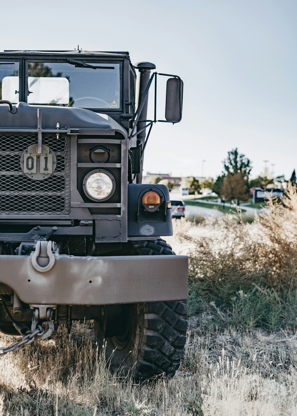 grey military truck on green bush