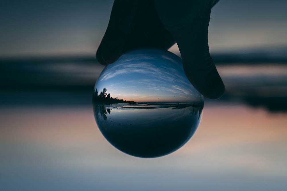 ball photography of body of water