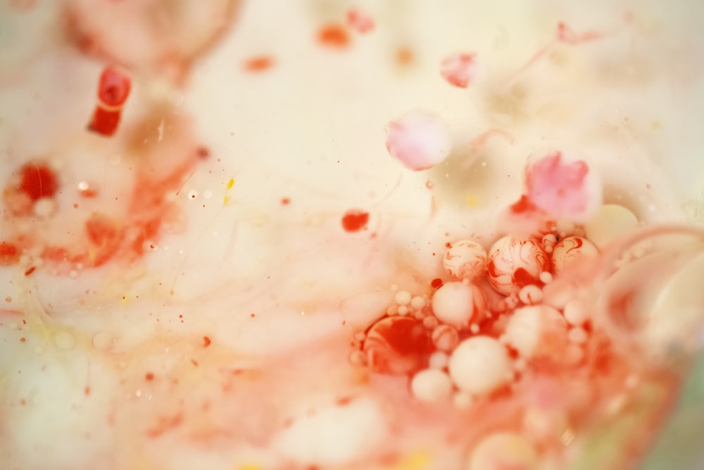 a mixture of red and white liquid in a bowl