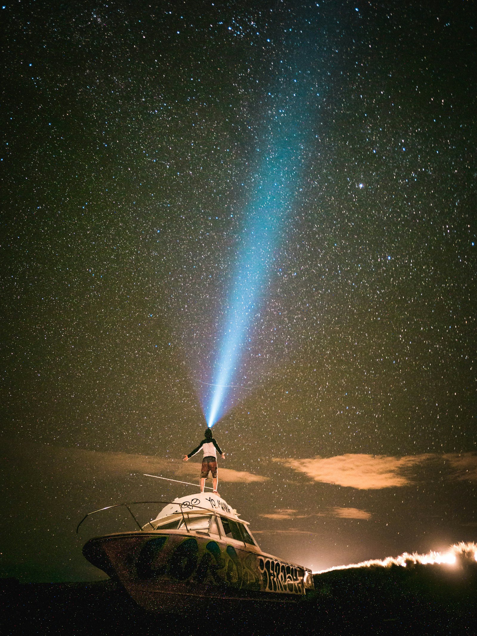 Panasonic Lumix G 14mm F2.5 ASPH sample photo. Man standing on boat photography