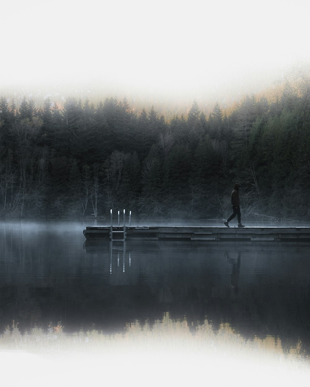 man walking on the ocean dock photography