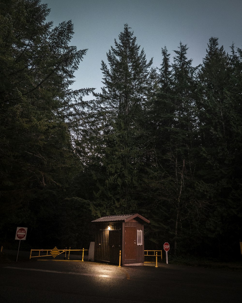 lighted brown wooden shed