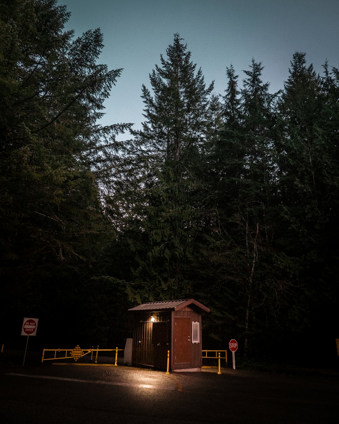 lighted brown wooden shed