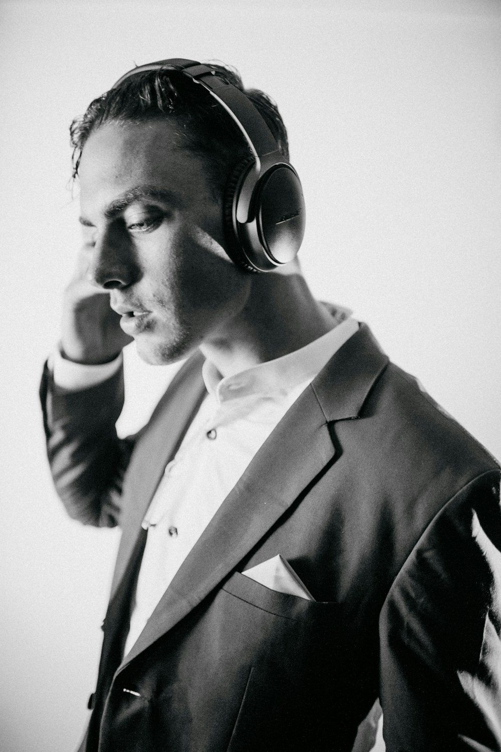 grayscale photography of man wearing headphones