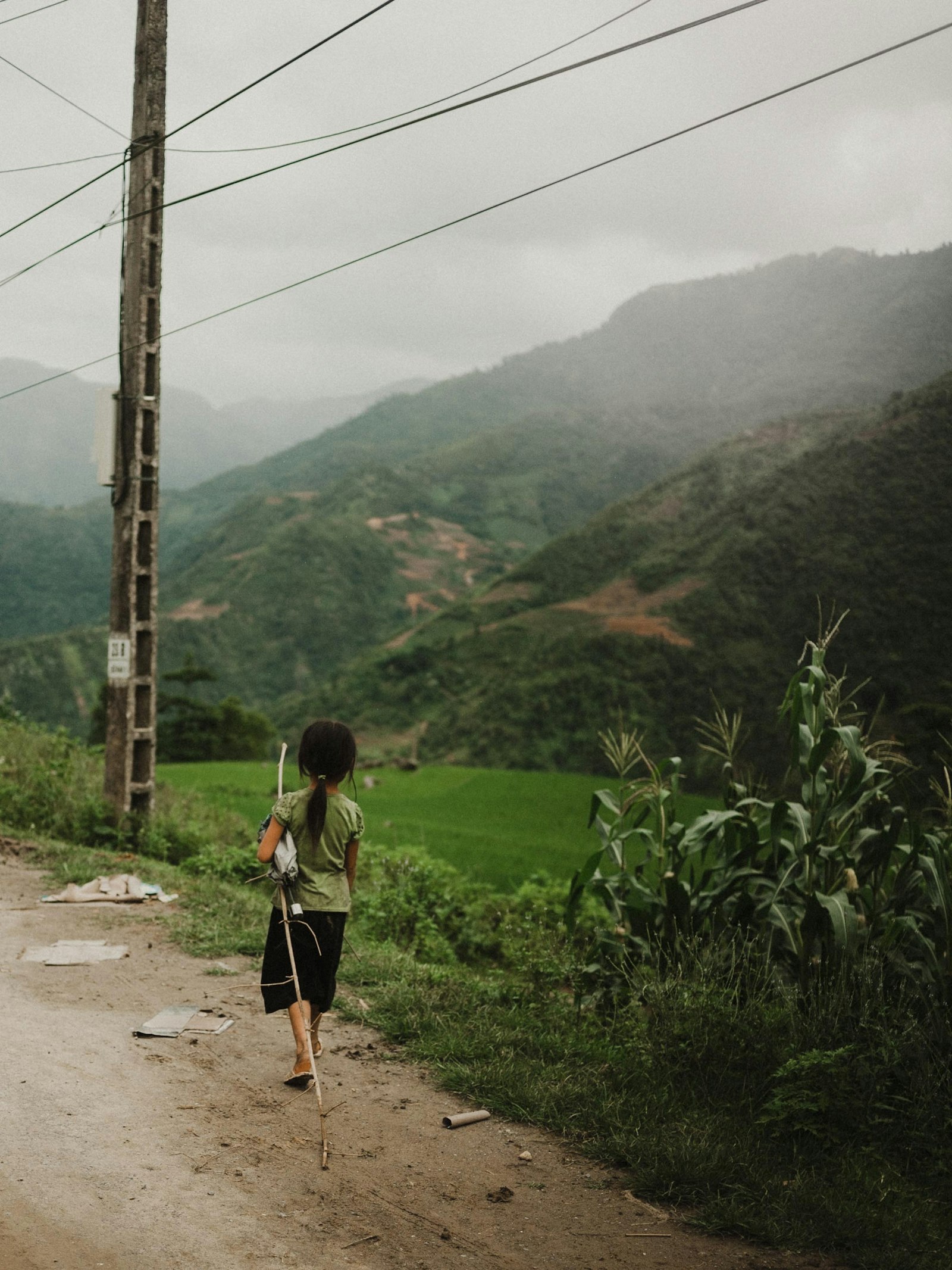 Canon EOS 5D + Canon EF 35mm F2 sample photo. Girl walking along rough photography