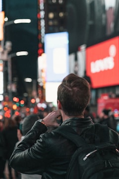 A journalist taking notes in a bustling urban environment, capturing stories.