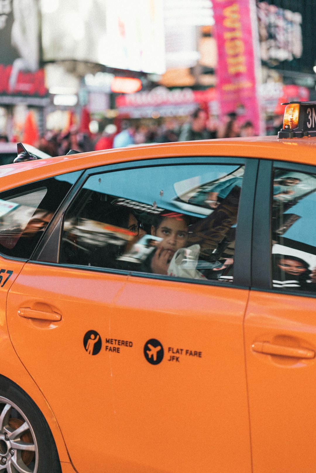 two women in orange cab