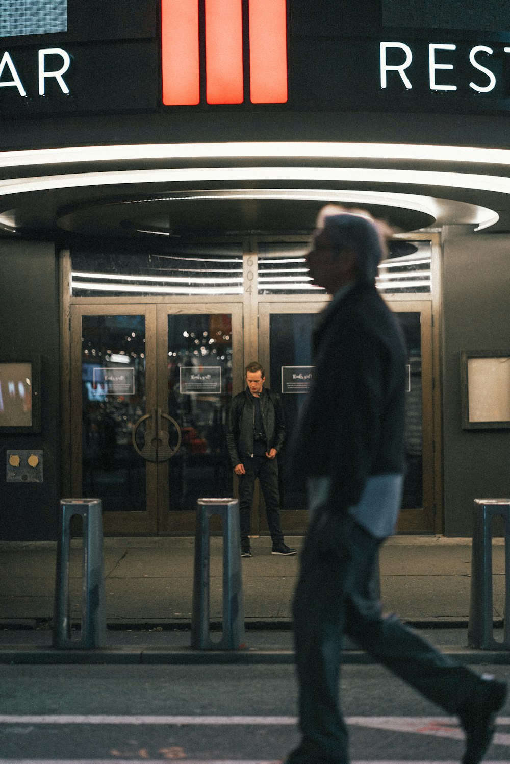 man walking near store