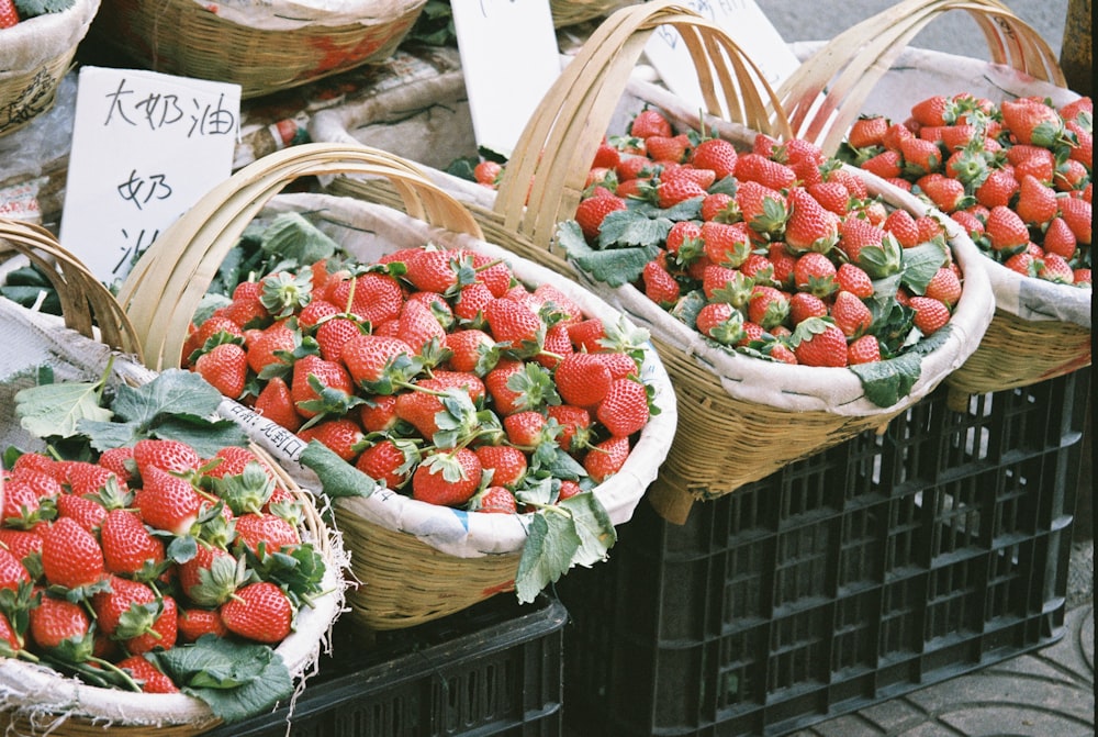 strawberries inside baskets