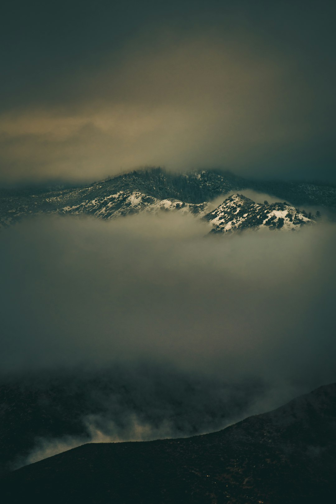 clouds covered by mountain