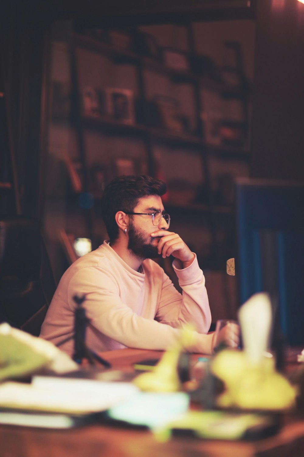 man sitting beside table