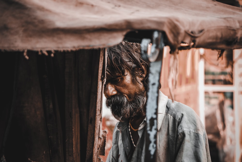 man under brown awning