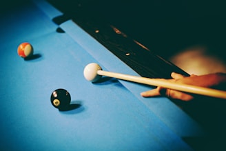 person playing billiard