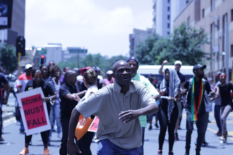 People marching through a South African city street during a protest