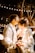 man kissing woman's forehead