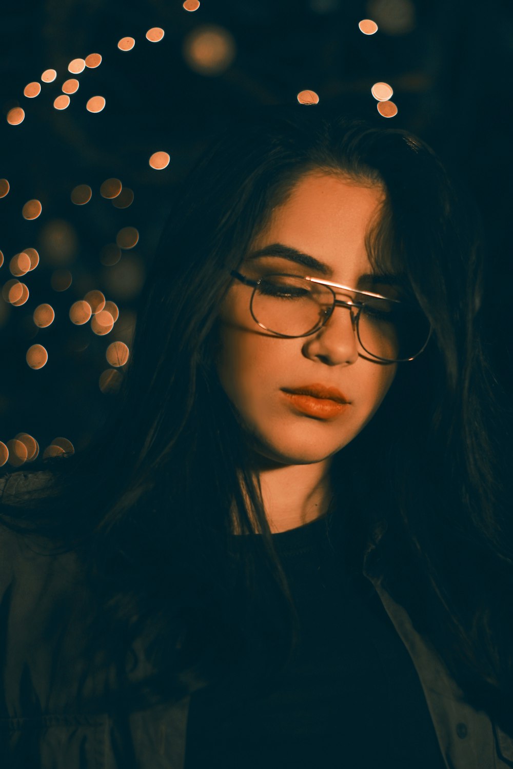 woman wearing gray-framed eyeglasses