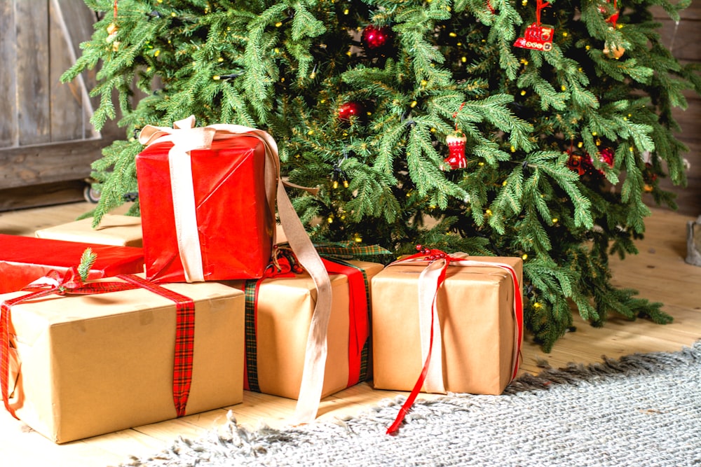 several gift boxes under Christmas tree