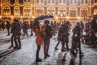 woman holding umbrella blizzard zoom background