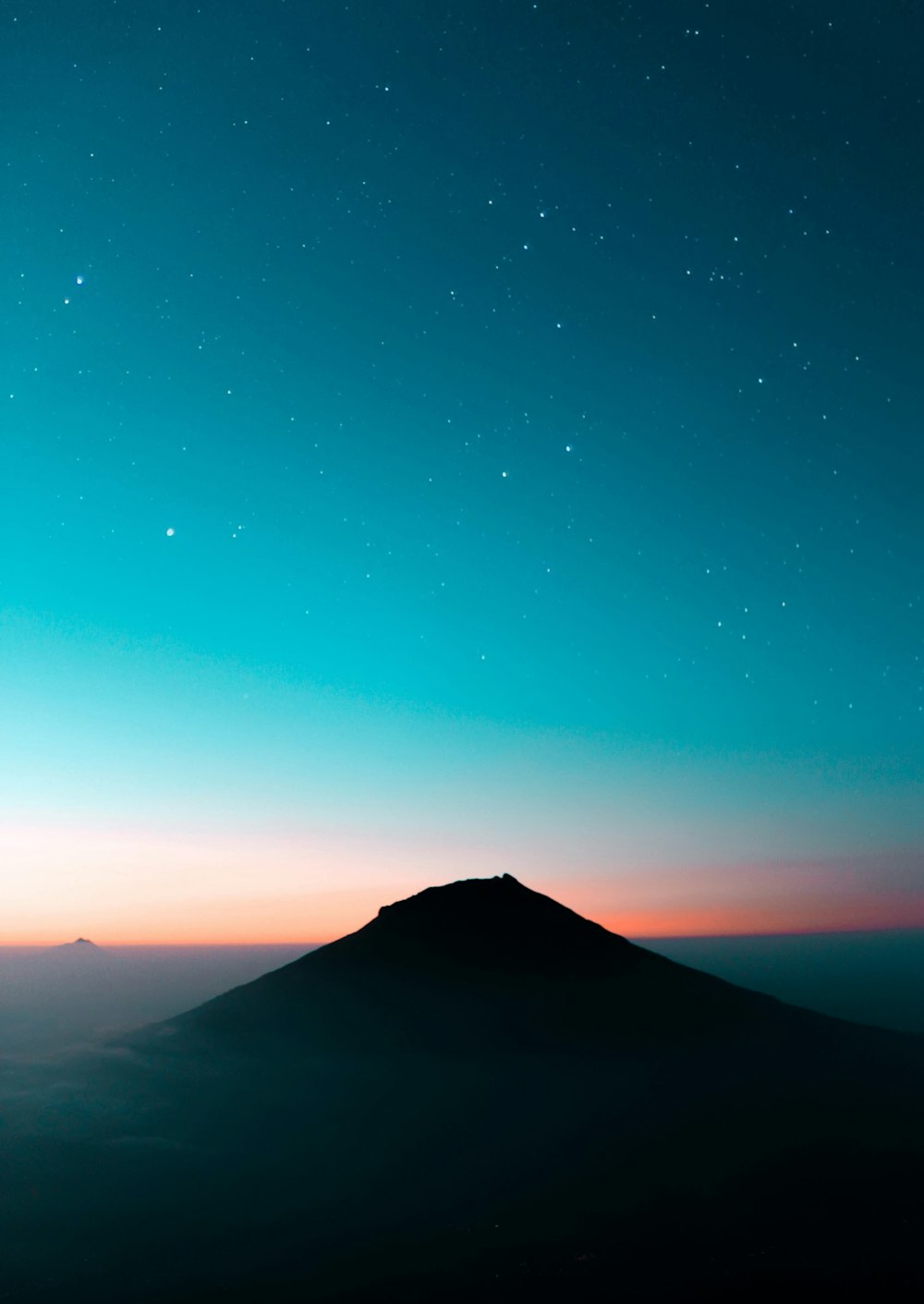 aerial photography of mountain under blue sky