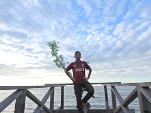 Photo of Joe Cardona and Jacob Lylery standing confidently in front of a New Jersey home.