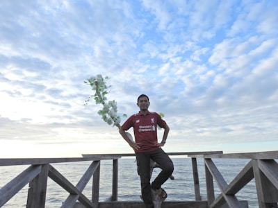 Photo of Joe Cardona and Jacob Lylery standing confidently in front of a New Jersey home.