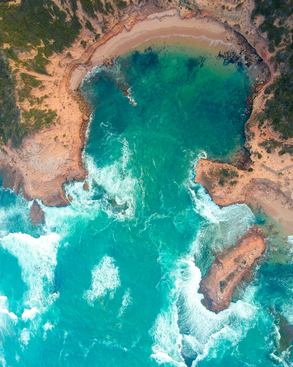 aerial photography of body of water near island