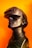 A sleek black mannequin head is adorned with a modern virtual reality headset, against a vibrant orange background. The VR headset is slightly futuristic in design, with smooth curves and a matte finish. A coiled black wire wraps around the neck of the mannequin, adding a sense of technological sophistication.