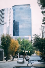 vehicles on road near building