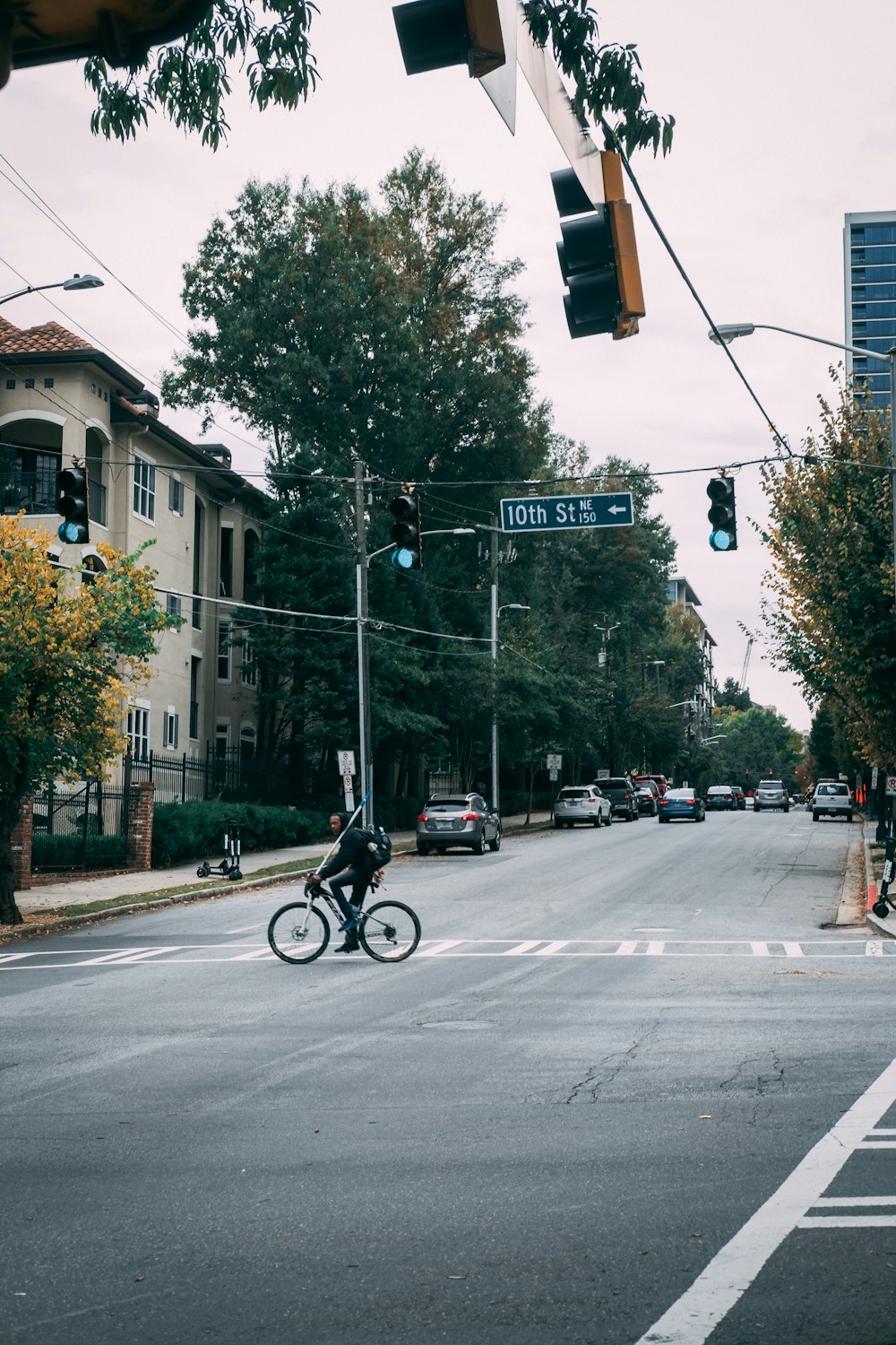 man riding bicycle on road