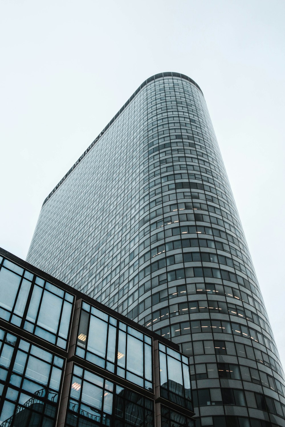 high-rise building under white sky