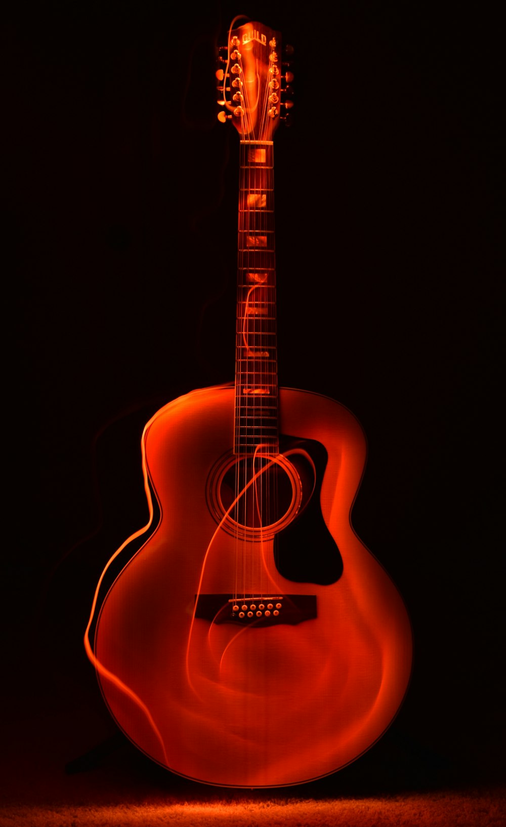 Fondo de pantalla de guitarra naranja