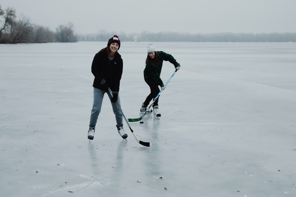 two women playing ice hockey