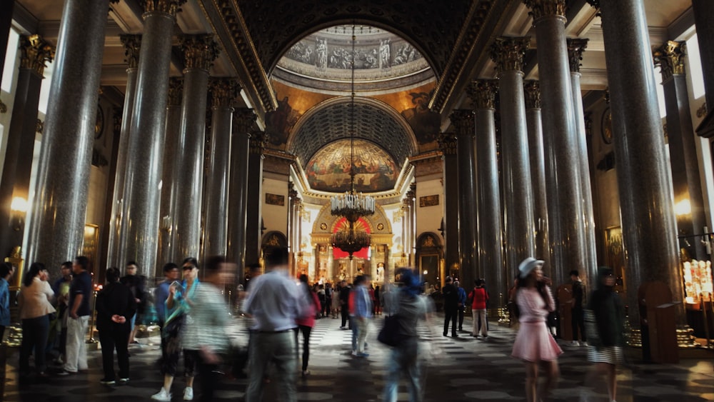 people standing and walking inside building