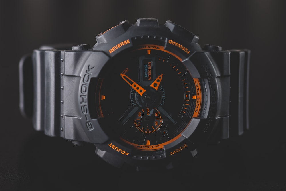 round black and orange Casio G-Shock analog watch