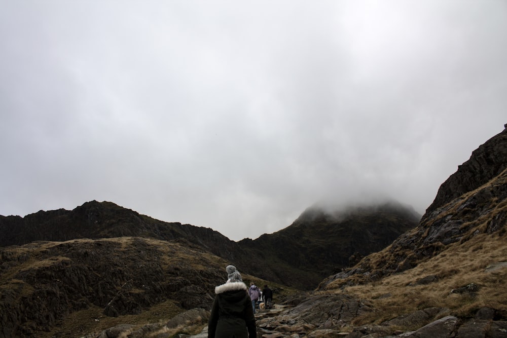 person walking on mountain