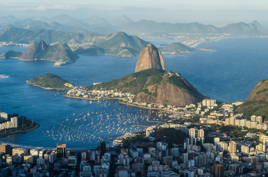Cable car ascending Sugarloaf Mountain above Guanabara Bay