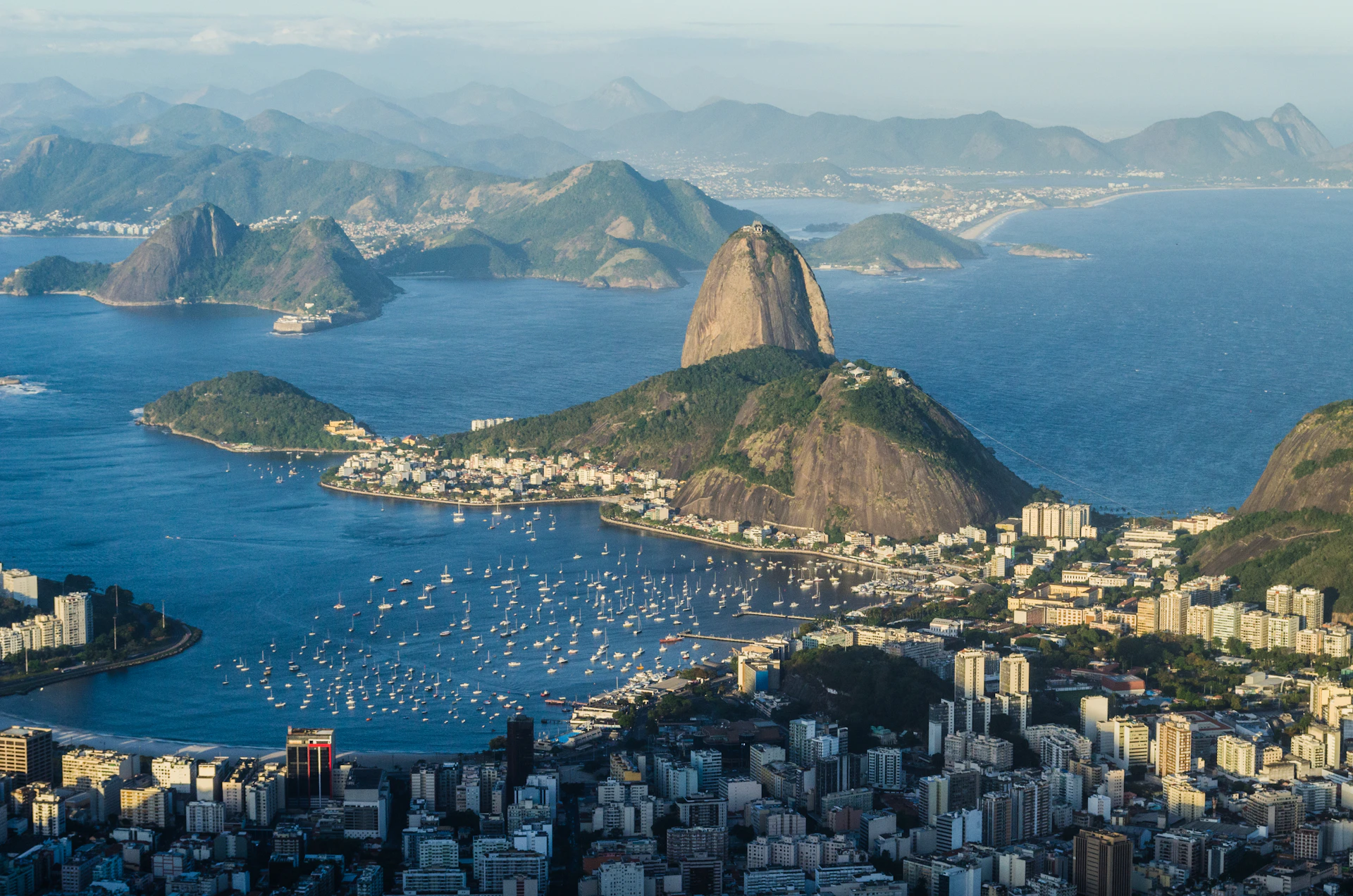 mountains and buildings on lake
