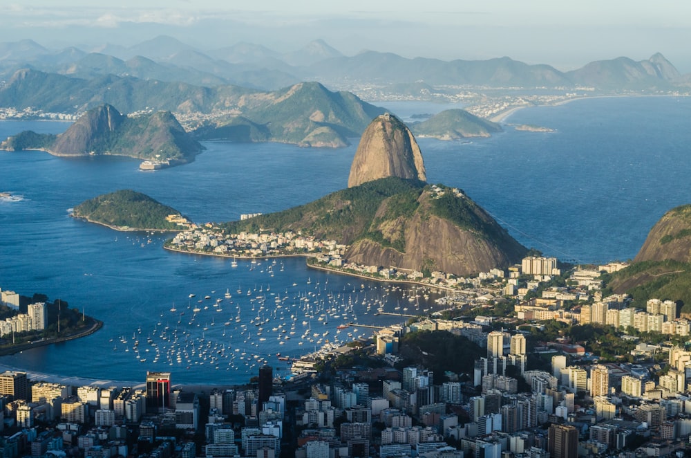 mountains and buildings on lake