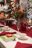 A festive table setup featuring custom gift boxes and party favors for a special event.