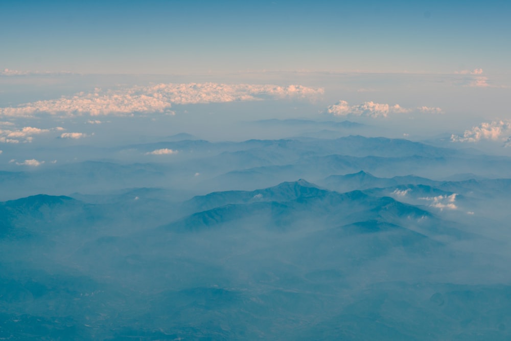 fog covering mountains during daytime