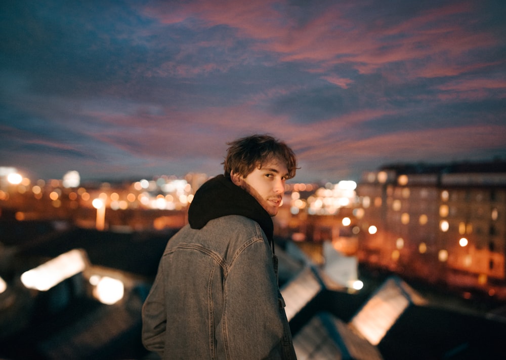 man wearing grey denim jacket