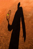 An elegant shadowbox featuring a signed tennis helmet and ball from a top athlete.